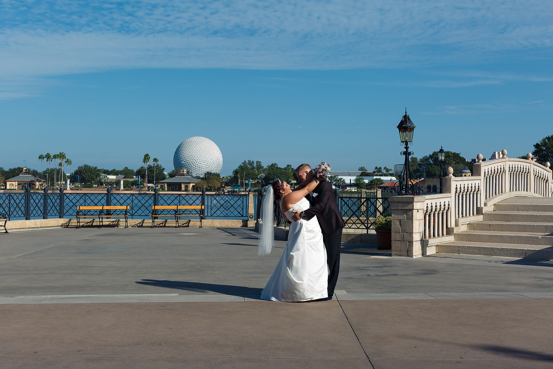 Wedding couple infront of epcot ball
