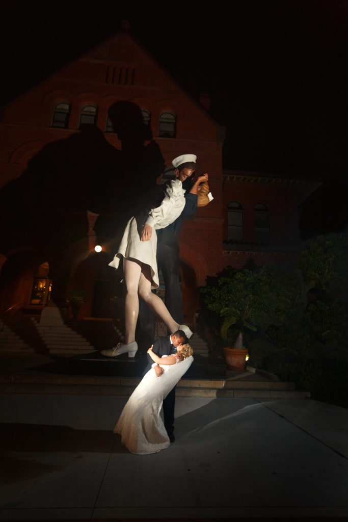 bride and groom remake sailor kissing nurse photo in key west destination wedding